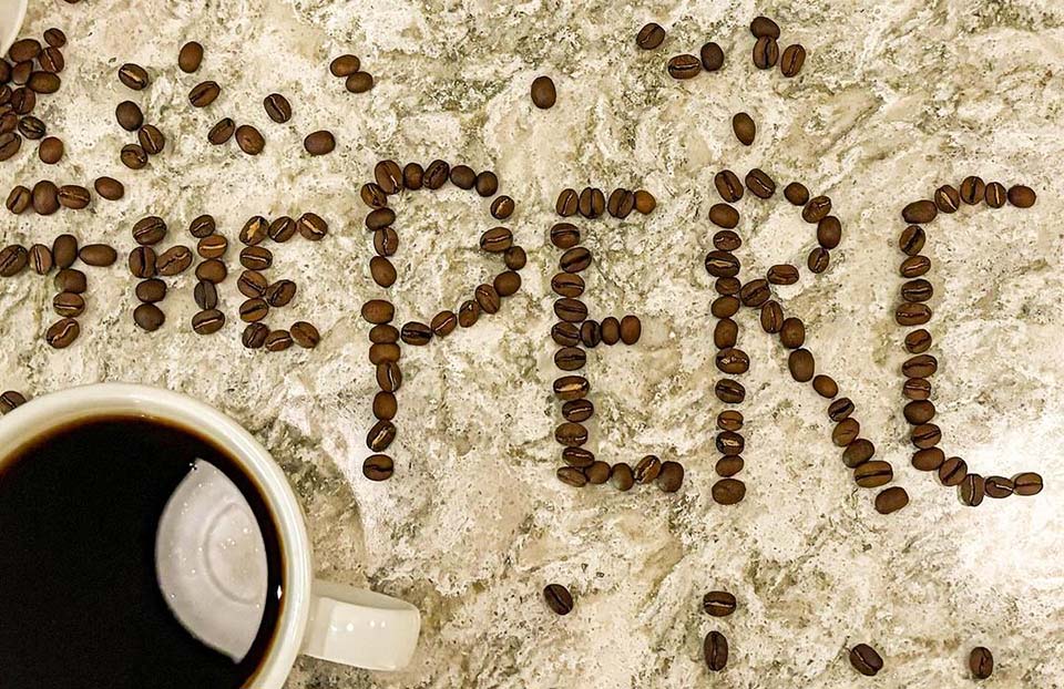 The Perc written in coffee beans