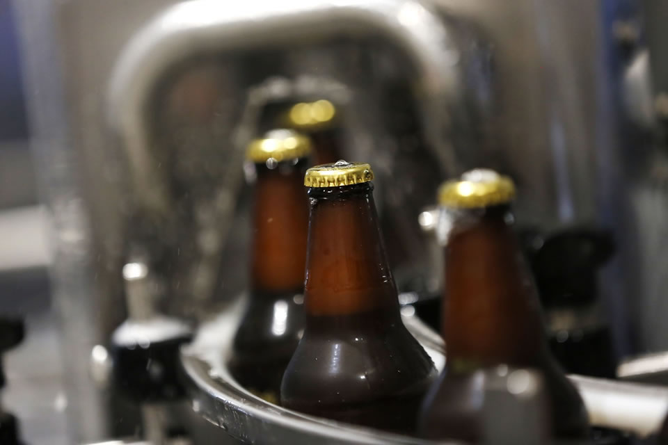 Beers being bottled at a manufacturing plant